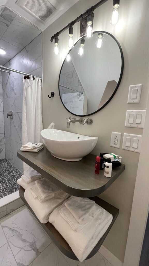 Bathroom with sink and shower at the Phineas Swann Inn & Spa