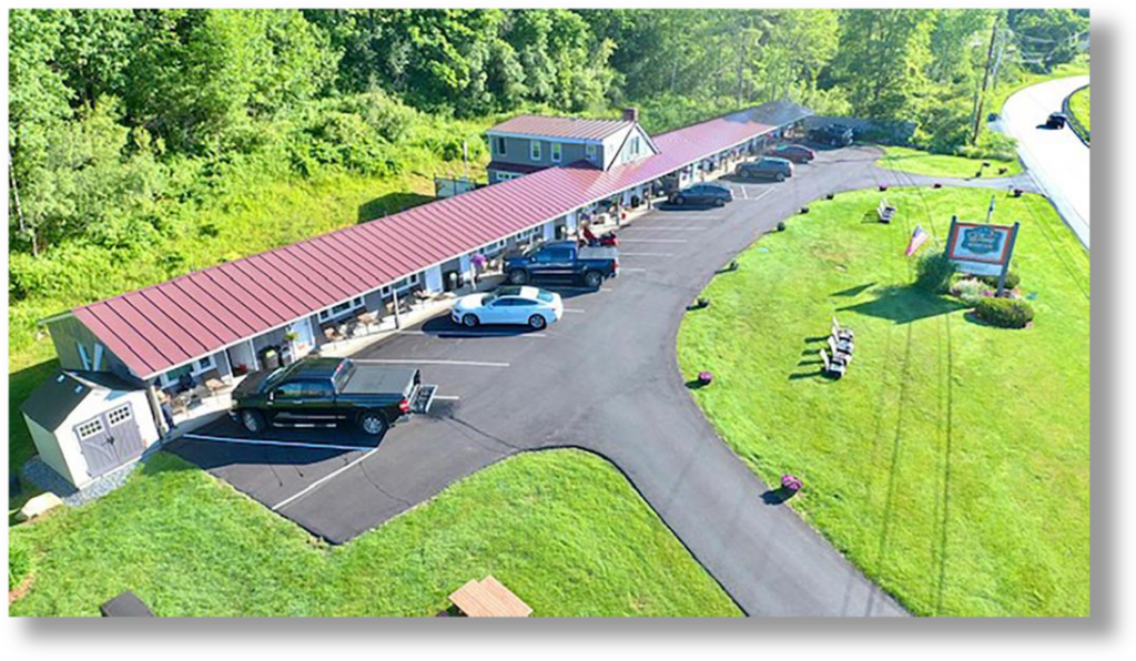 header aerial image of the Sleep Woodstock Motel in Summer